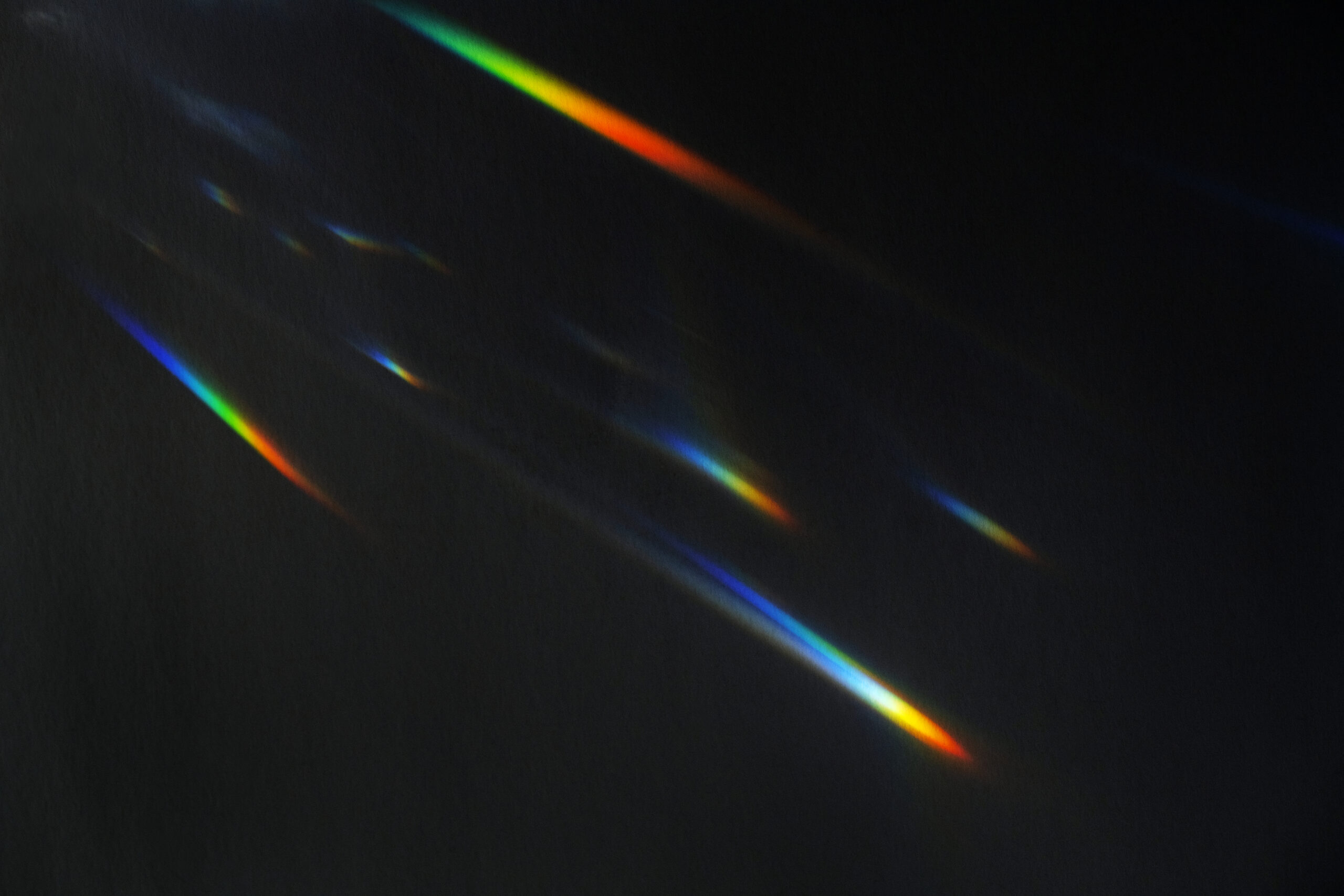 light leak effect on a black background wallpaper